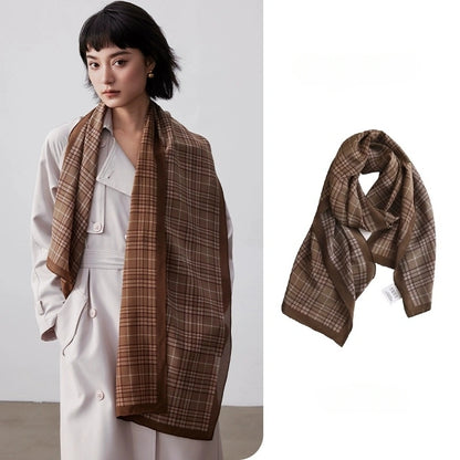 Coffee plaid long silk scarf styled over a white trench coat with matching flat lay detail