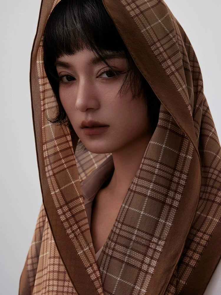 Coffee plaid long silk scarf worn as a hooded wrap for vintage styling