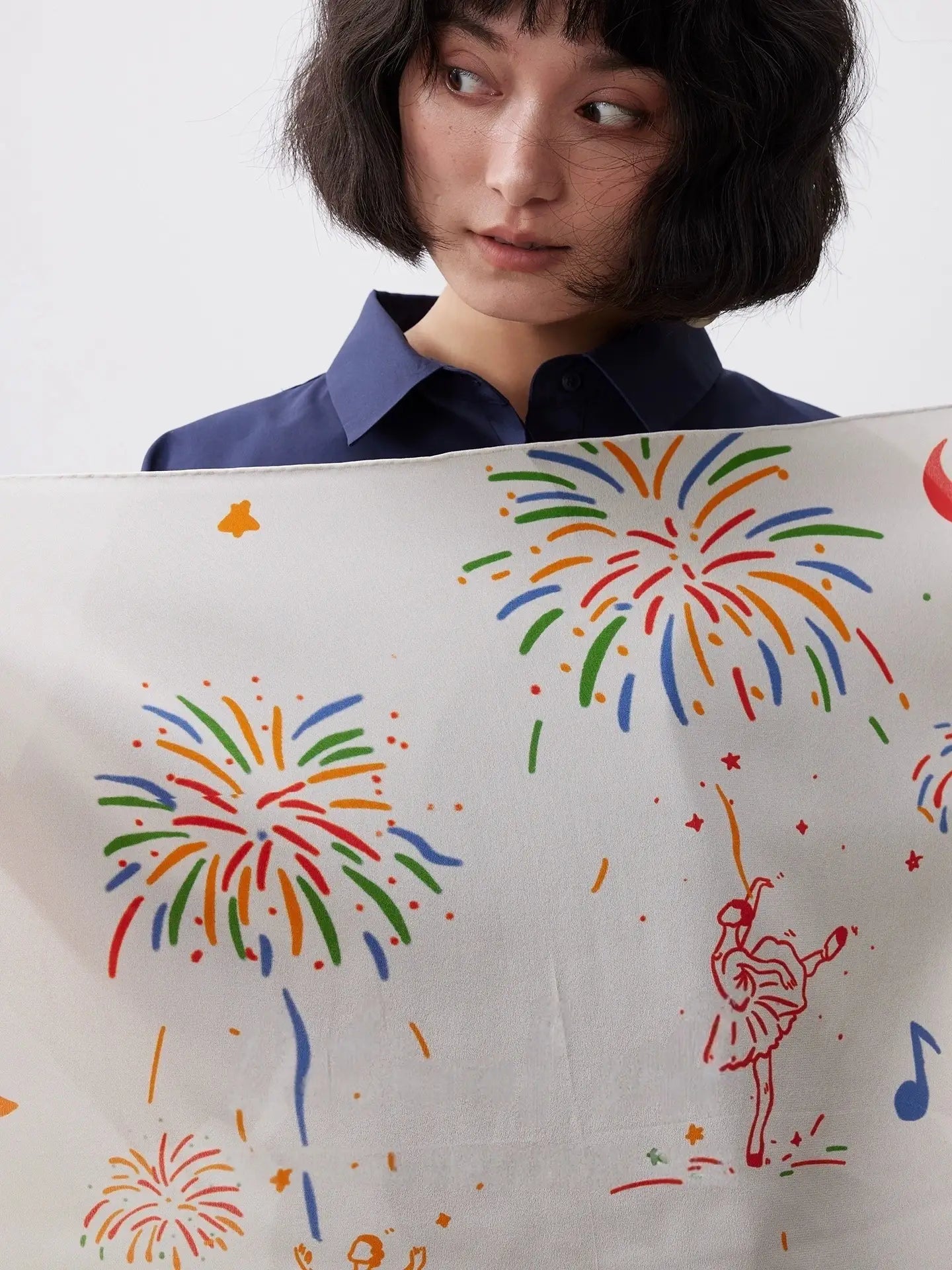 Close-up of Celebration Finale silk scarf with fireworks ballerina and music note print