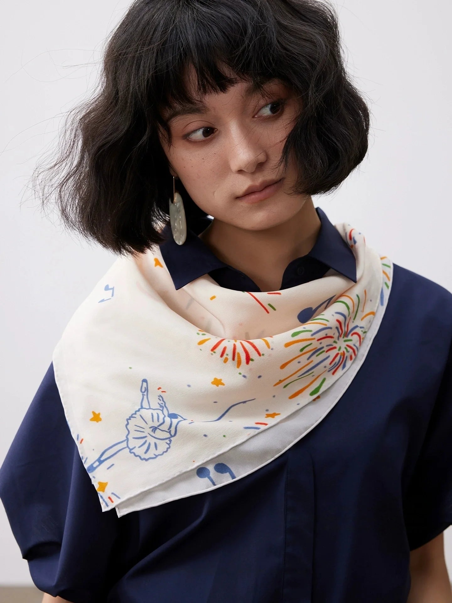 Celebration Finale silk square scarf styled as a soft neck scarf for elegant daily wear