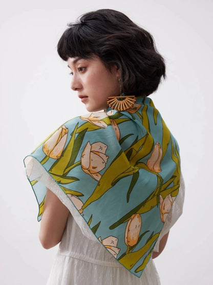 Green tulip floral silk scarf draped across the back for elegant styling