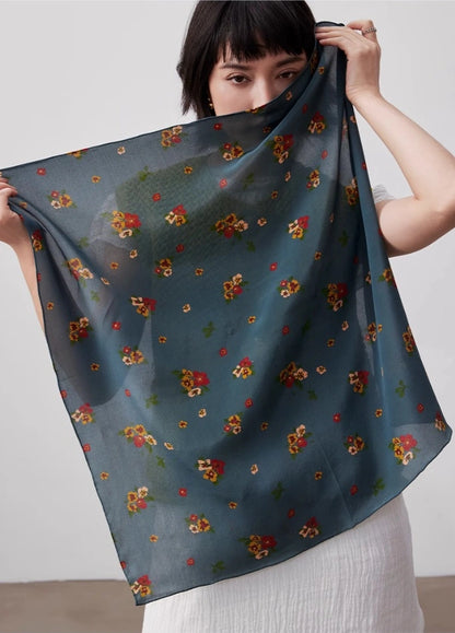 Greenish-blue floral silk square scarf, 100% mulberry silk, displayed flat to highlight its elegant floral design.