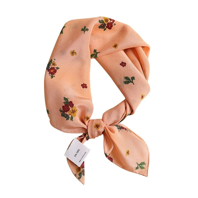 Light orange floral silk square scarf, 100% mulberry silk, highlighting vibrant floral design.