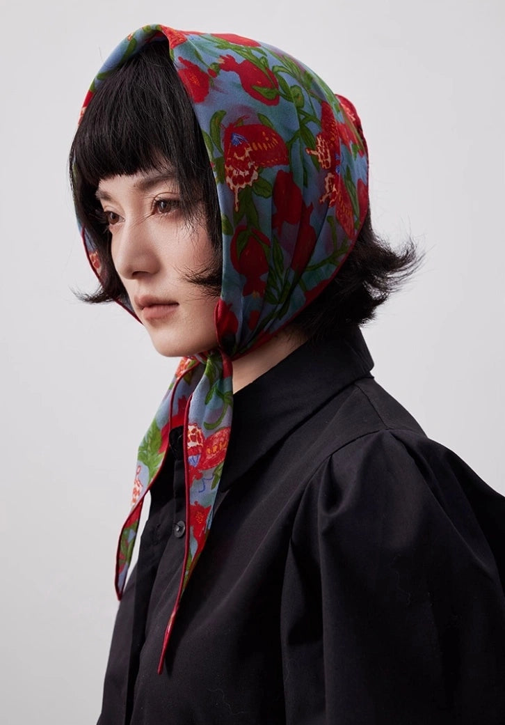 Lupine blue triangle silk scarf worn as a silk head wrap with a black outfit