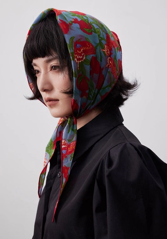 Lupine blue triangle silk scarf worn as a silk head wrap with a black outfit