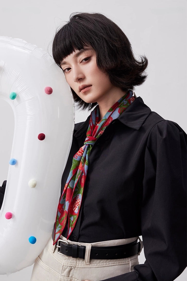 Lupine blue mulberry silk triangle scarf styled as a necktie with a black shirt