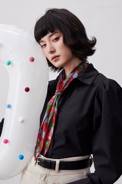 Lupine blue mulberry silk triangle scarf styled as a necktie with a black shirt