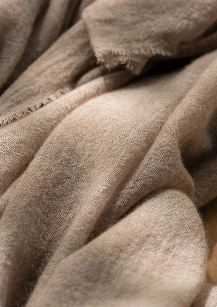 Mocha brown cashmere scarf, showcasing its breathable and lightweight cashmere fabric.