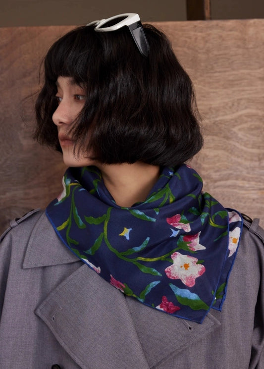 Midnight Blue silk square scarf styled as a neck accessory, demonstrating its elegance and versatility.