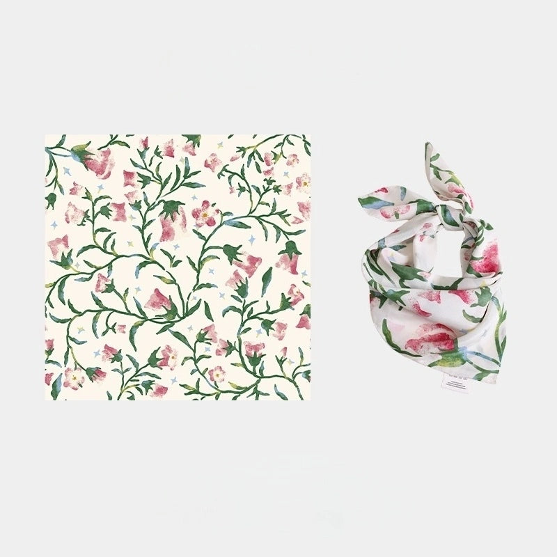 Close-up of Moonlight White silk scarf, showcasing the intricate morning glory floral pattern and luxurious texture.