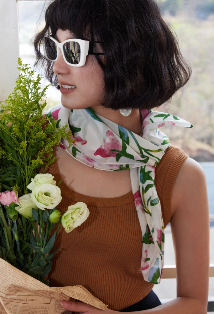 Moonlight White silk square scarf styled as a neck accessory, demonstrating its timeless elegance and versatility.