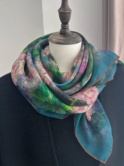 Plant-dyed floral mulberry silk square scarf styled on a mannequin