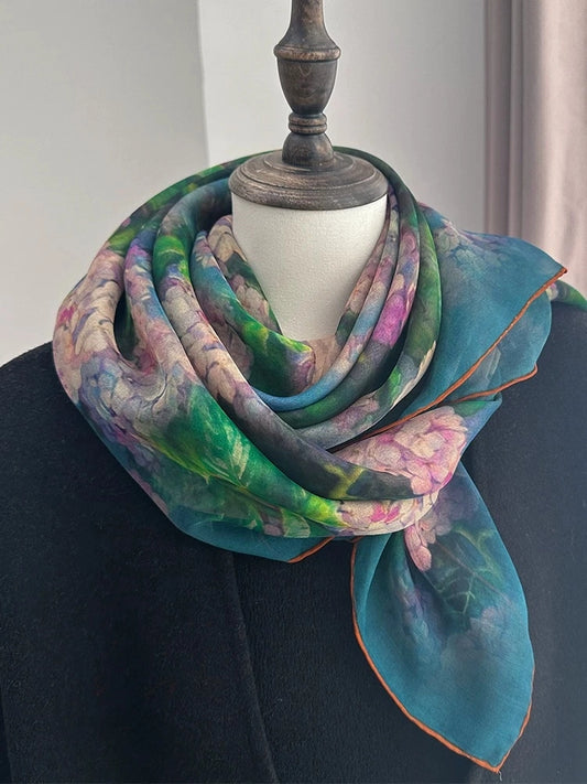 Plant-dyed floral mulberry silk square scarf styled on a mannequin