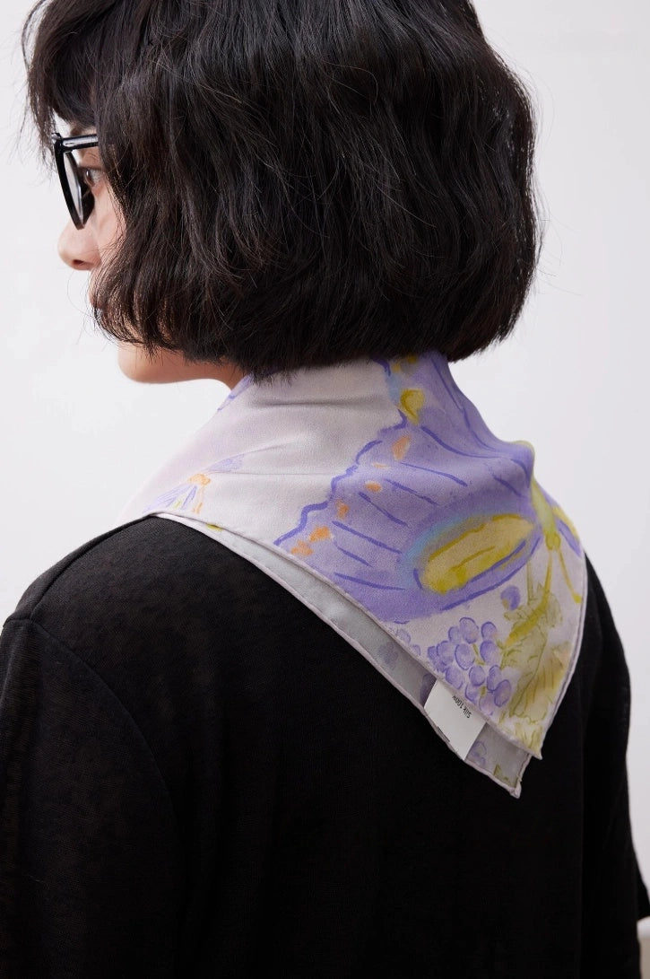 Purple butterfly silk square scarf worn as a back neck scarf for elegant styling