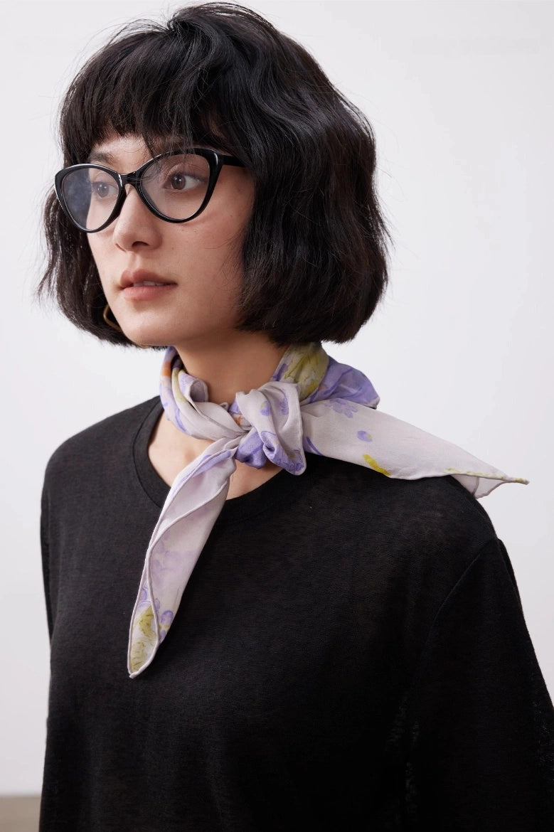 Purple butterfly mulberry silk scarf tied neatly at the neck for daily wear