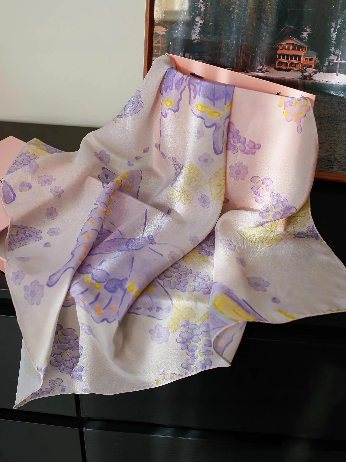 Purple butterfly print silk square scarf displayed in natural light with soft silk texture
