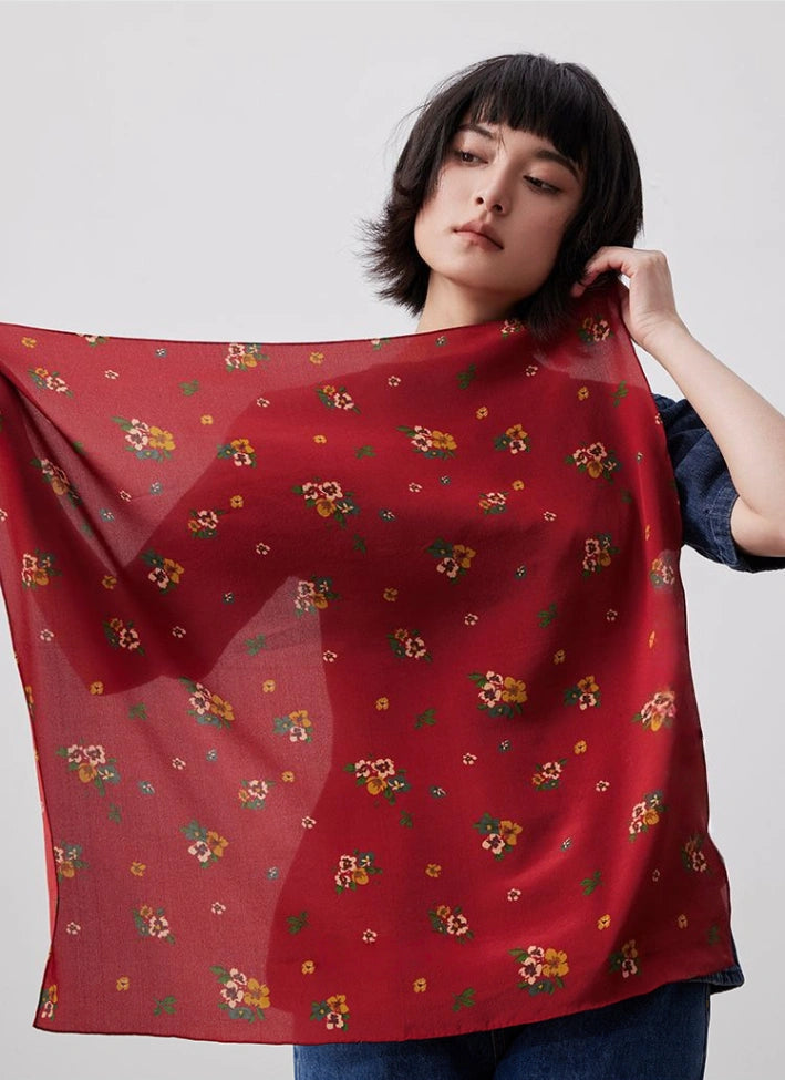 Red floral silk square scarf, 100% mulberry silk, displayed flat to highlight its vibrant floral design.