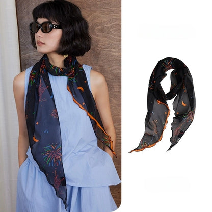 Black fireworks skinny silk scarf made from 100% mulberry silk, styled as a lightweight neck scarf with product detail view