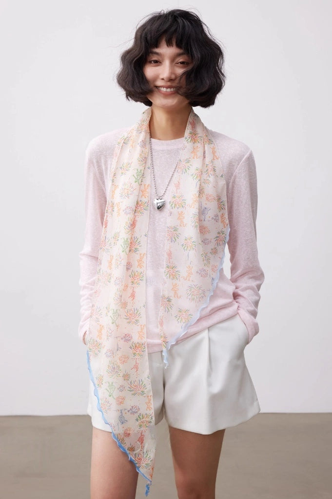 White fireworks skinny silk scarf worn as a long mulberry silk scarf for a soft elegant look