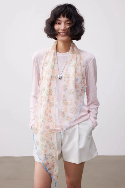 White fireworks skinny silk scarf worn as a long mulberry silk scarf for a soft elegant look