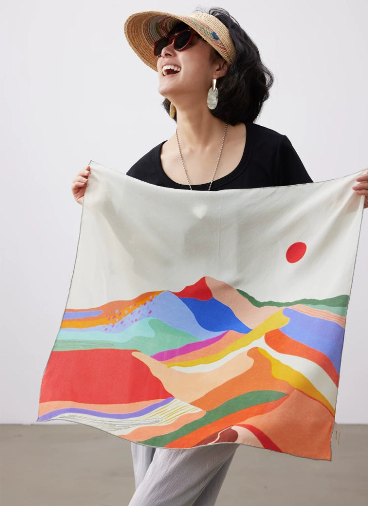 Abstract sunset mountain mulberry silk square scarf displayed open, featuring hand-painted hills, color waves and red sun design