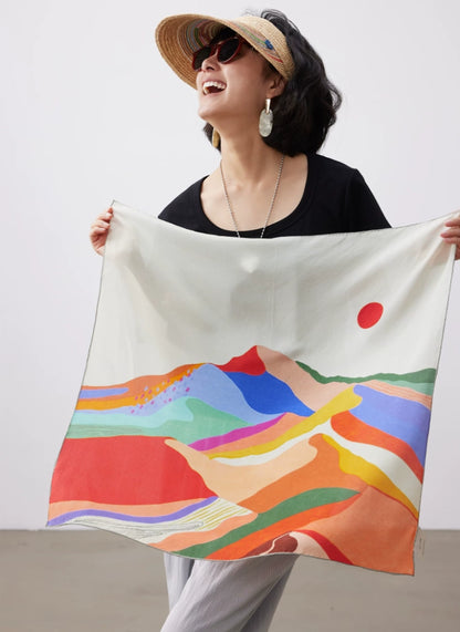 Abstract sunset mountain mulberry silk square scarf displayed open, featuring hand-painted hills, color waves and red sun design