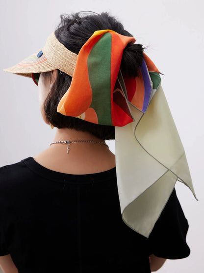 Abstract sunset mountain silk square scarf styled as a bandana headscarf with colorful hand-painted landscape design