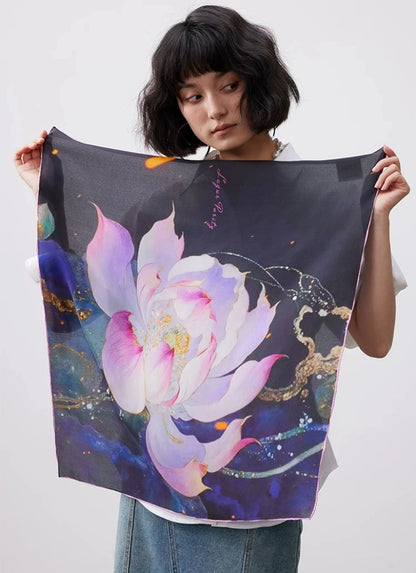 Watercolor lotus mulberry silk square scarf displayed by model, showing full floral print and soft silk drape