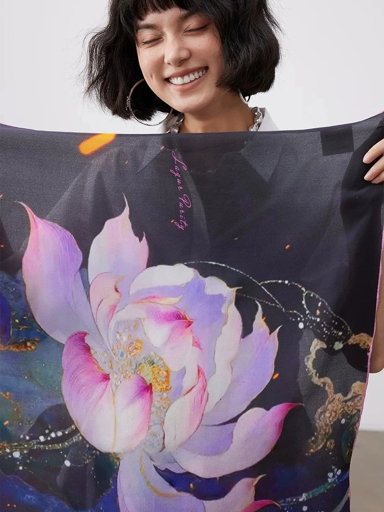 Close-up of artistic lotus print silk square scarf in charcoal, purple, pink, and blue watercolor tones