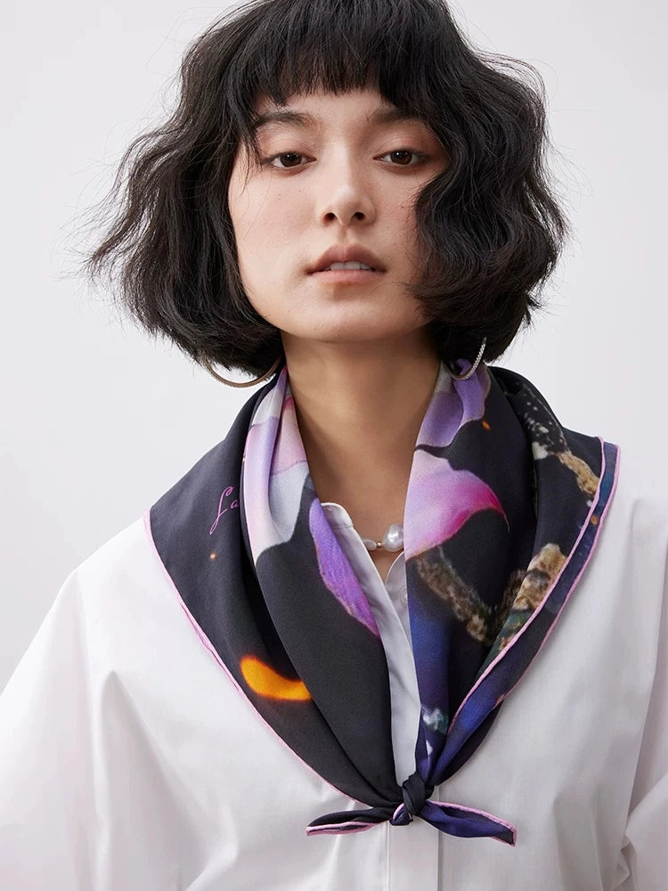 Elegant floral silk scarf worn around the neck, featuring a lotus print on smooth mulberry silk