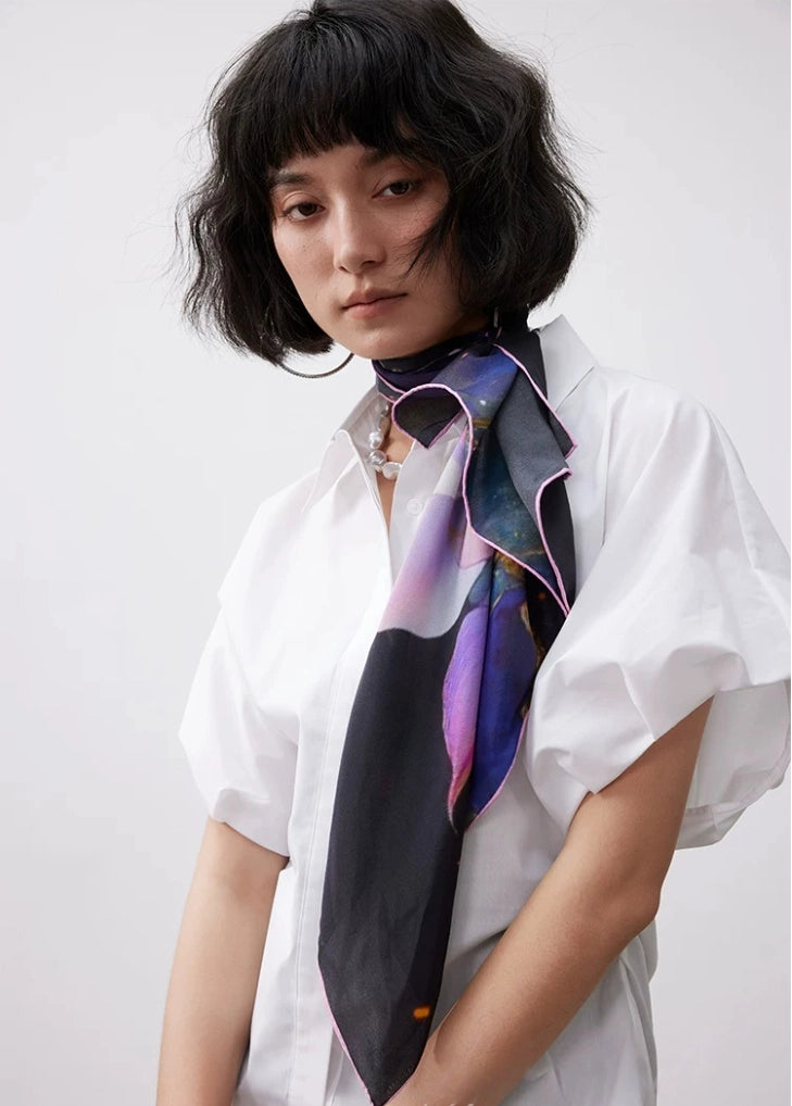 100% mulberry silk square scarf with watercolor lotus design styled with a minimalist white blouse