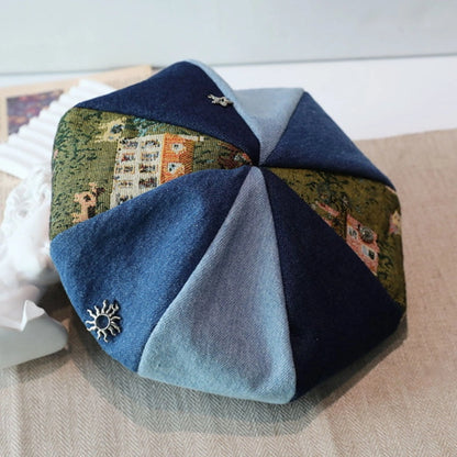Close-up of artistic vintage beret newsboy cap with denim and jacquard patchwork