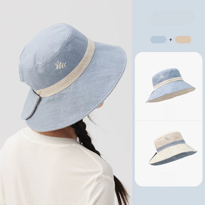 Beige blue reversible embroidered bucket hat shown from the back with two-sided color options