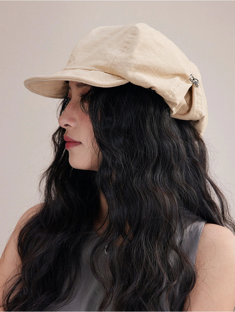 Model wearing beige slouchy cotton beret hat, a lightweight cotton beret for effortless everyday style