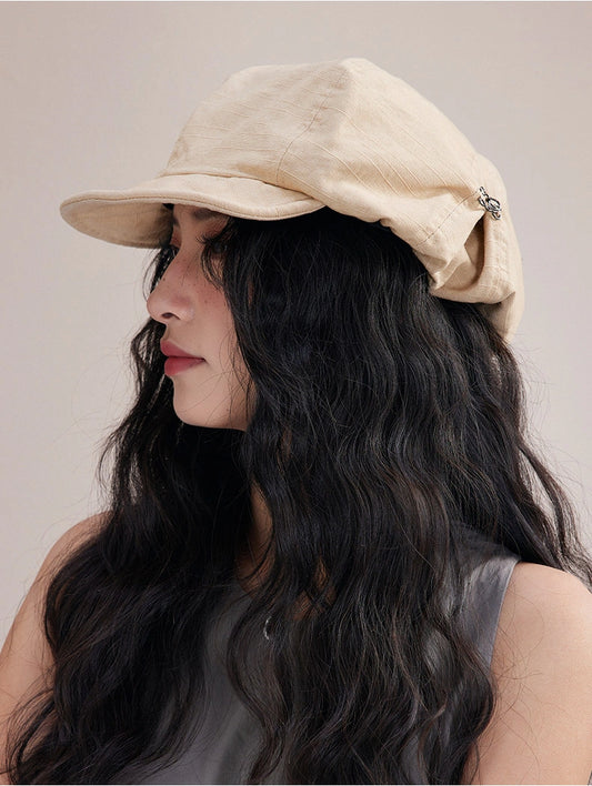 Model wearing beige slouchy cotton beret hat, a lightweight cotton beret for effortless everyday style