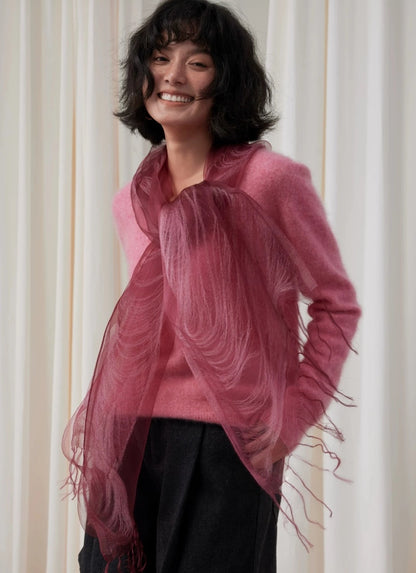 Sheer berry mulberry silk wrap draped across the shoulders with delicate fringe