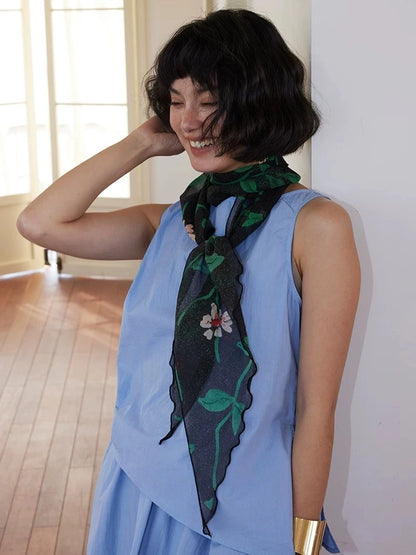 Skinny botanical silk scarf styled as a soft neck ribbon