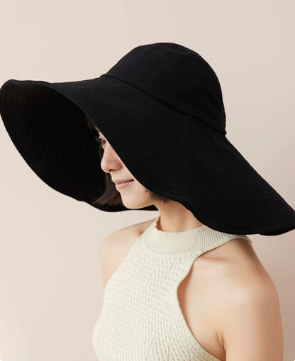 Black floppy wide brim sun hat for women with breathable cotton fabric and elegant summer shape