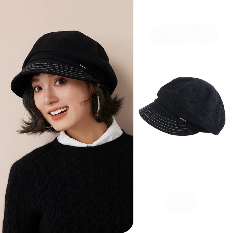 Black fleece-lined newsboy cap for women, shown on a model beside an angled view of the hat.