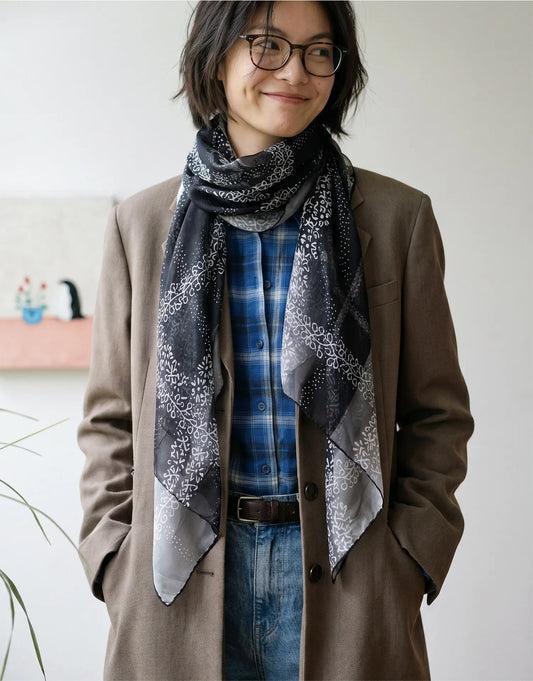 Black floral mulberry silk scarf paired with a brown blazer for an elegant vintage look