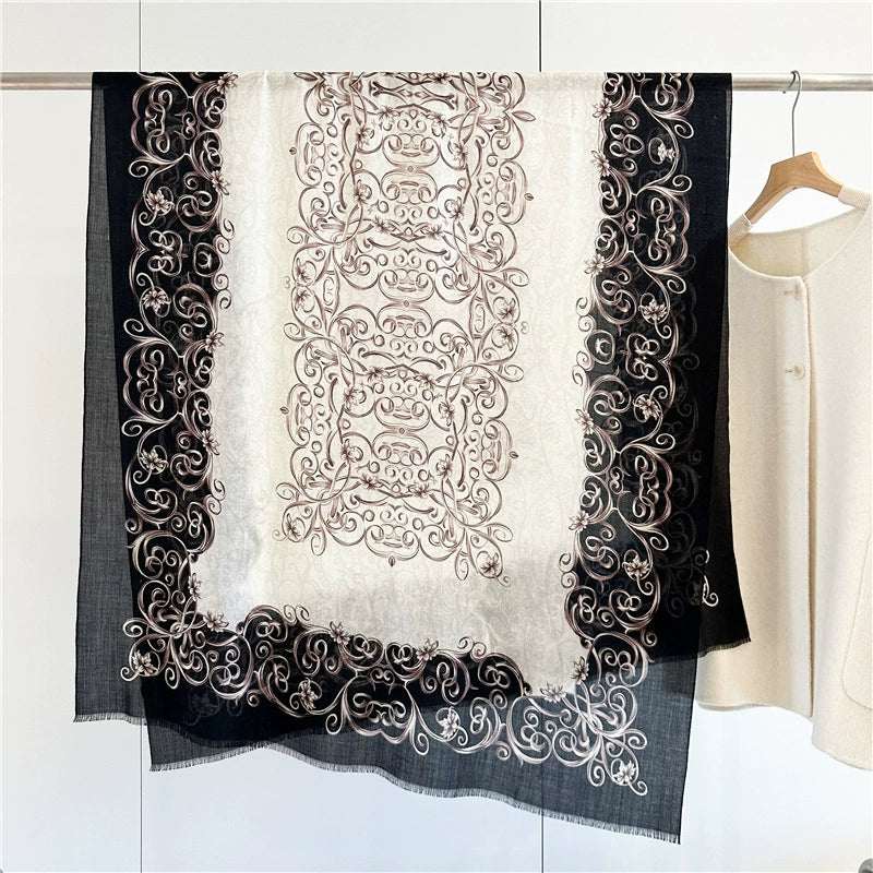Black and ivory Baroque swirl fine wool scarf displayed flat with ornate borders and fringed edges