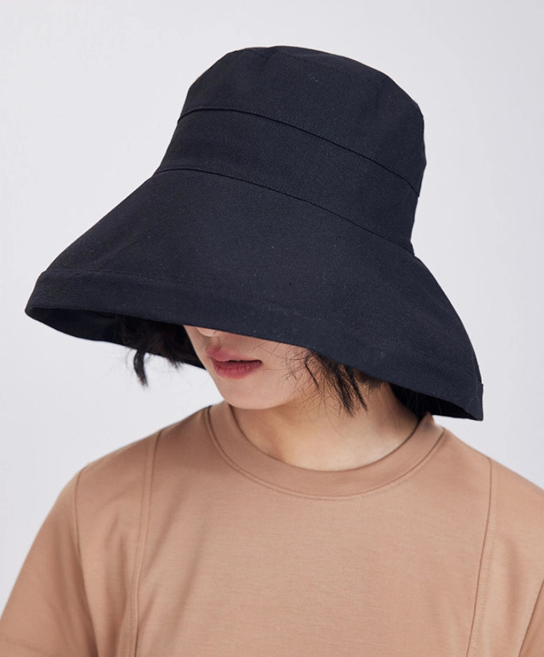 Black adjustable linen blend sun hat with a deep brim providing shade around the face