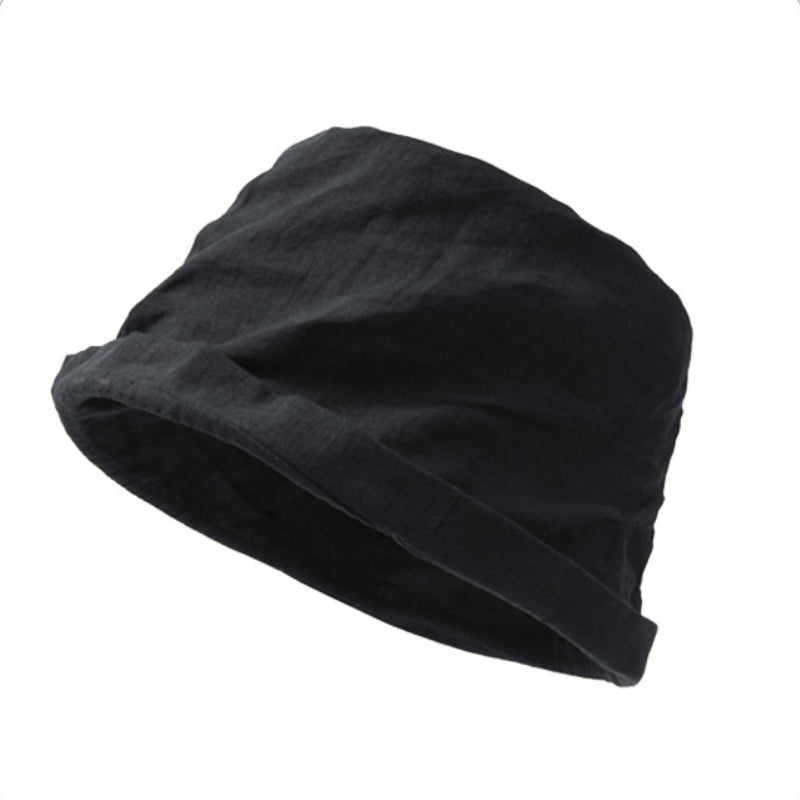 Black foldable linen bucket hat with hand-crinkled crown and soft rolled brim