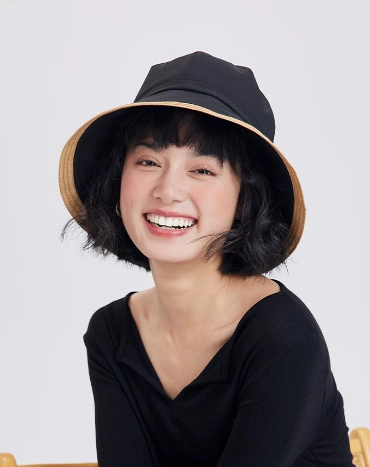 model wearing a black wide brim sun hat with beige contrast brim for summer casual styling