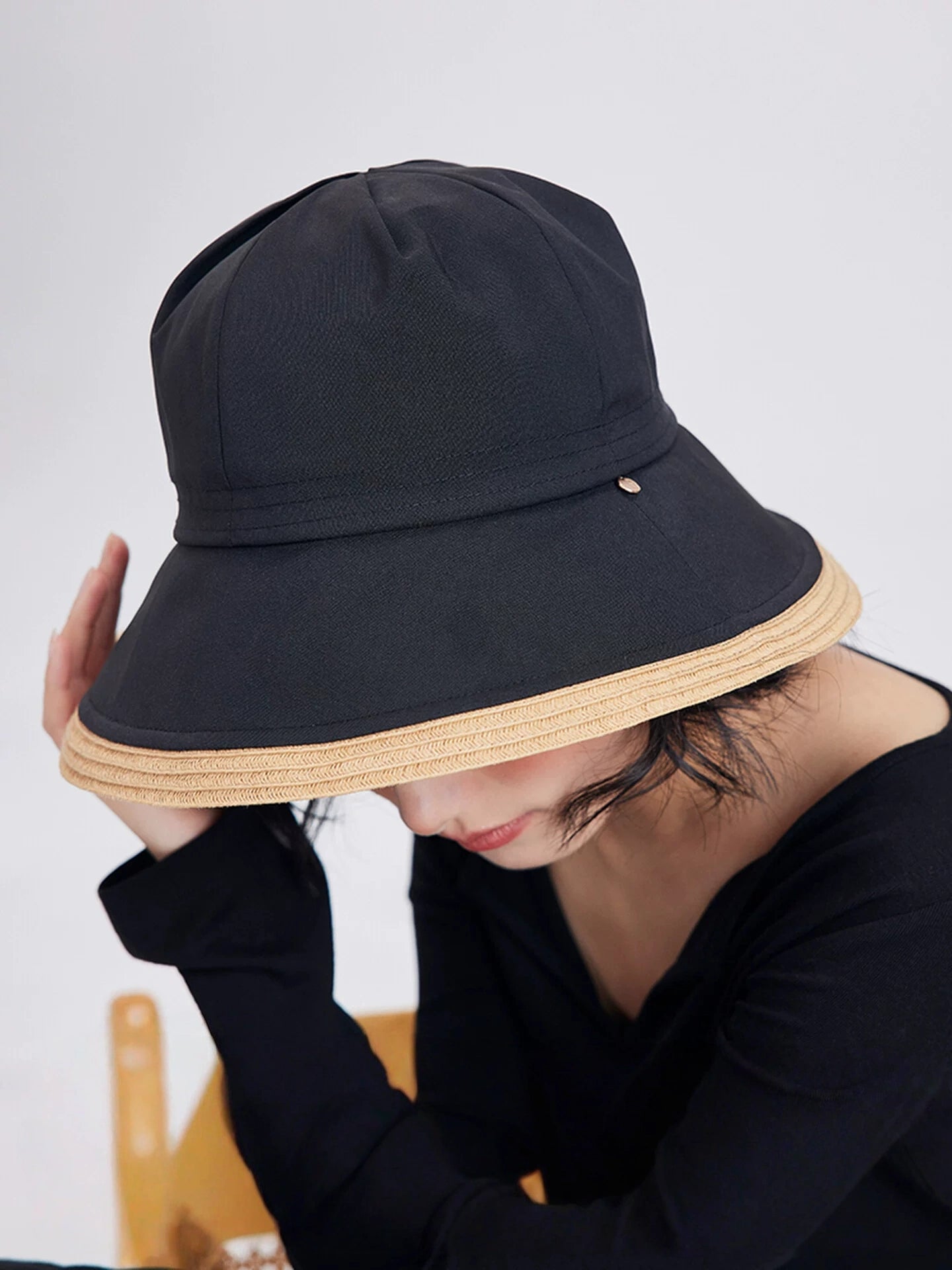 black travel-friendly sun hat with wide brim for beach vacation and outdoor sun coverage