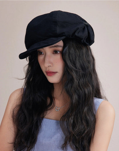 Model wearing black slouchy cotton beret hat, a lightweight cotton beret for effortless streetwear style