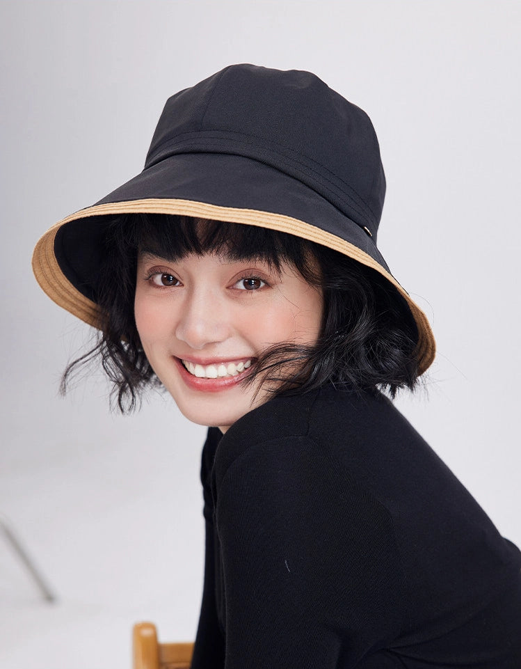 Black summer hat with natural brim styled for a casual warm-weather outfit