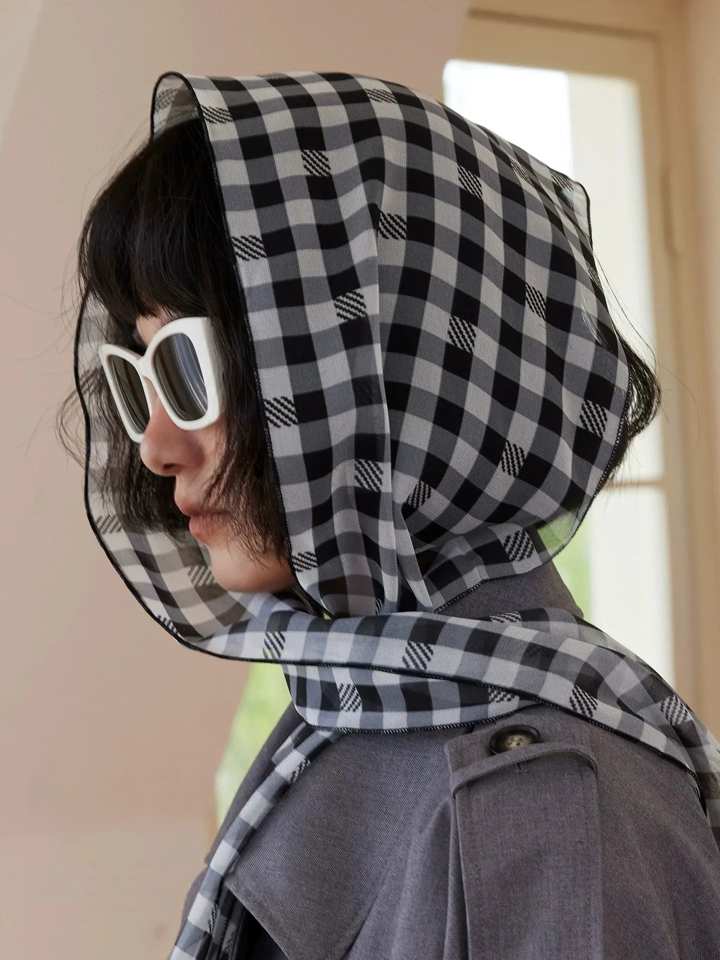 Black and white gingham mulberry silk scarf worn as a head scarf with soft georgette drape