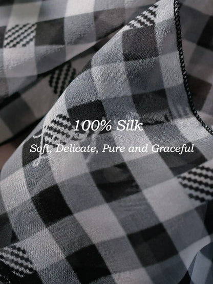 Close-up of black white gingham 100% mulberry silk scarf with smooth lightweight texture