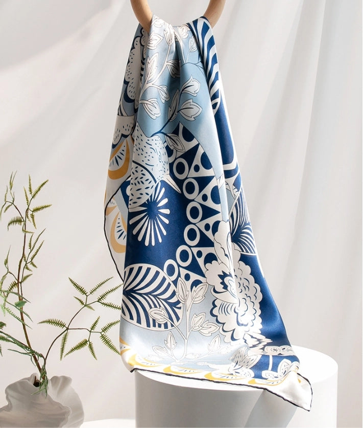 100% mulberry silk large square scarf styled with blue bird and floral artwork for elegant daily wear.